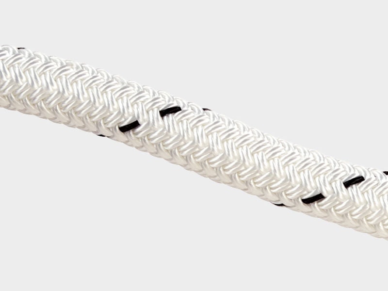 Close-up of durable white Cortland rope with black accents for marine and industrial applications.
