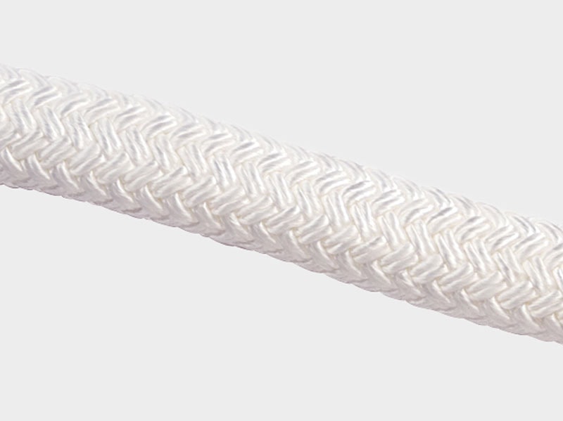 Close-up of white braided rope, durable marine-grade cord for sailing and boating.