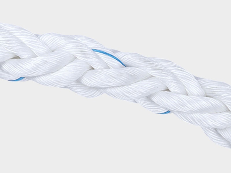 Close-up of white synthetic rope with blue accents for marine use.